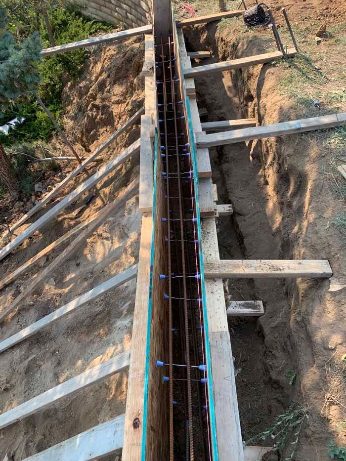 Wooden concrete formwork with rebar reinforcement.