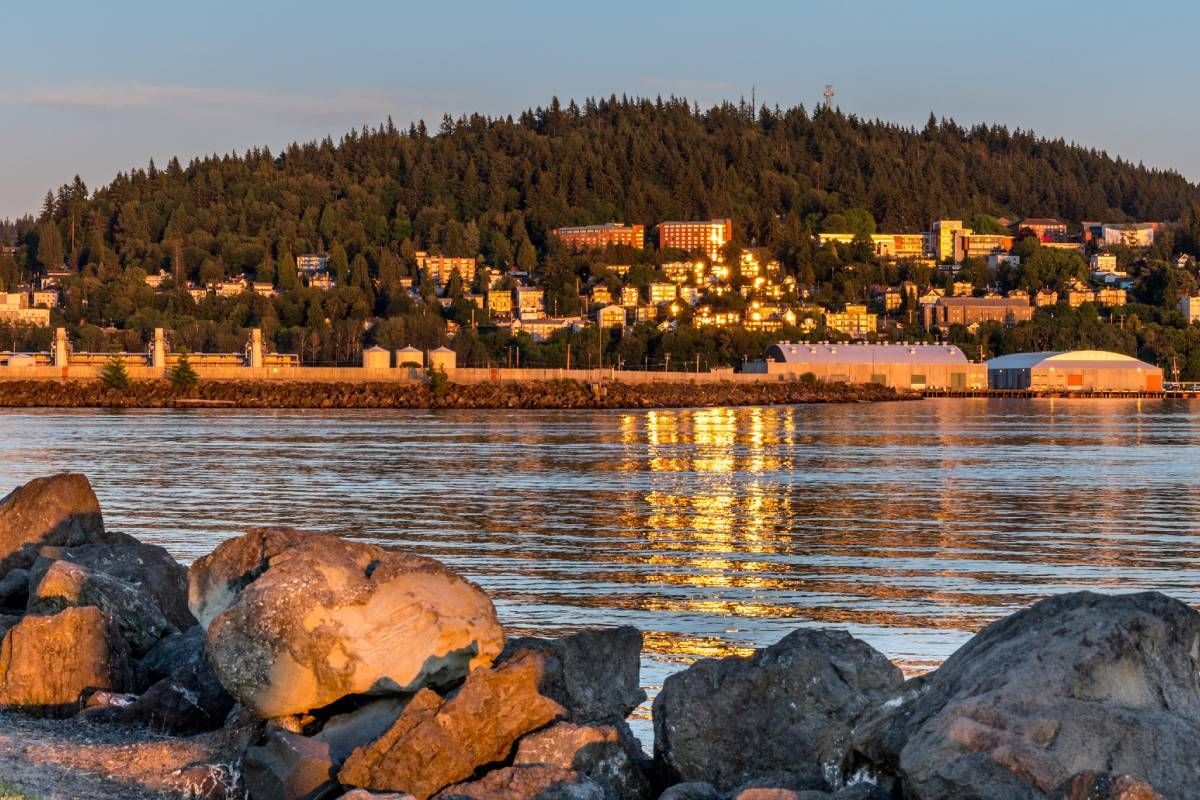 An image of Bellingham, Washington, at sunset, bathes local businesses and residences in a golden glow