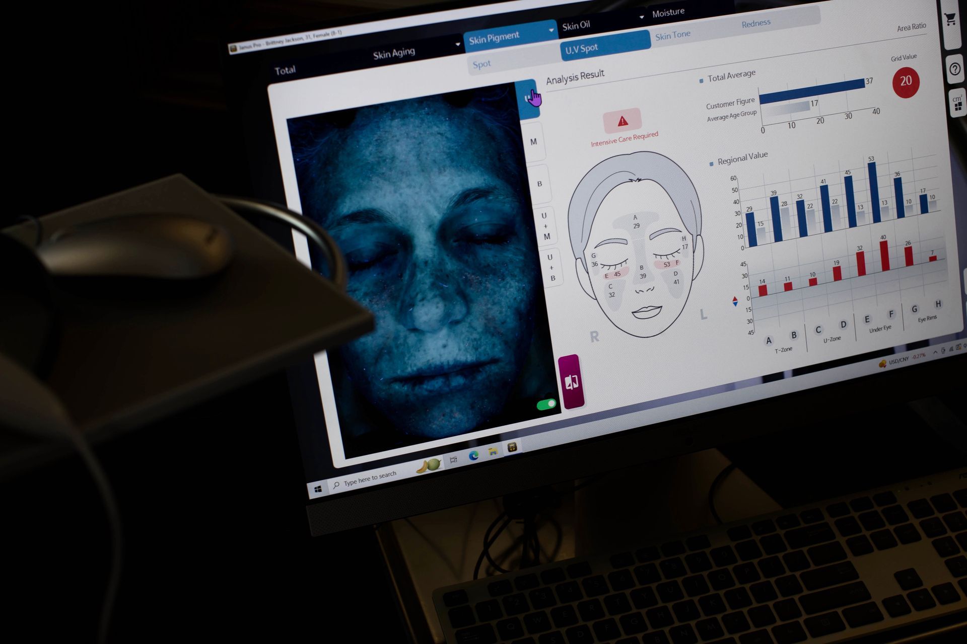 A computer monitor with a picture of a woman 's face on it