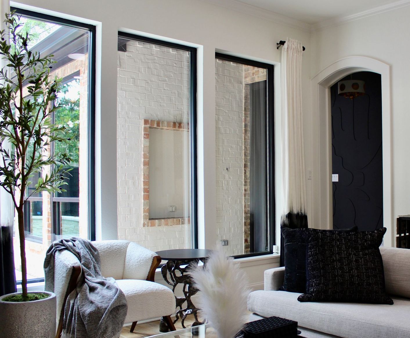 A living room with a couch , chair and table