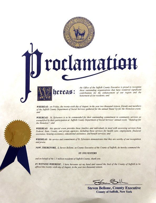 Decorative proclamation certificate with gold seal and blue ribbon on a white background