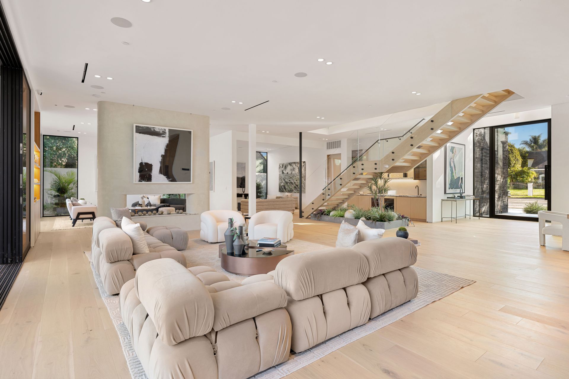 Open-concept luxury home living space with neutral decor.