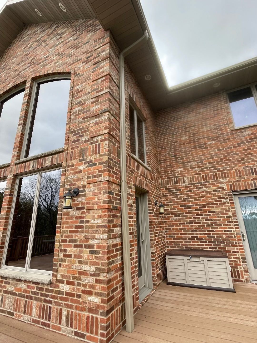 newly installed gutters on a brick home