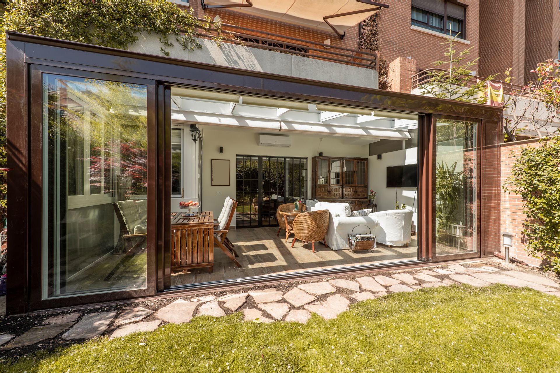 Sunroom with open sliding doors