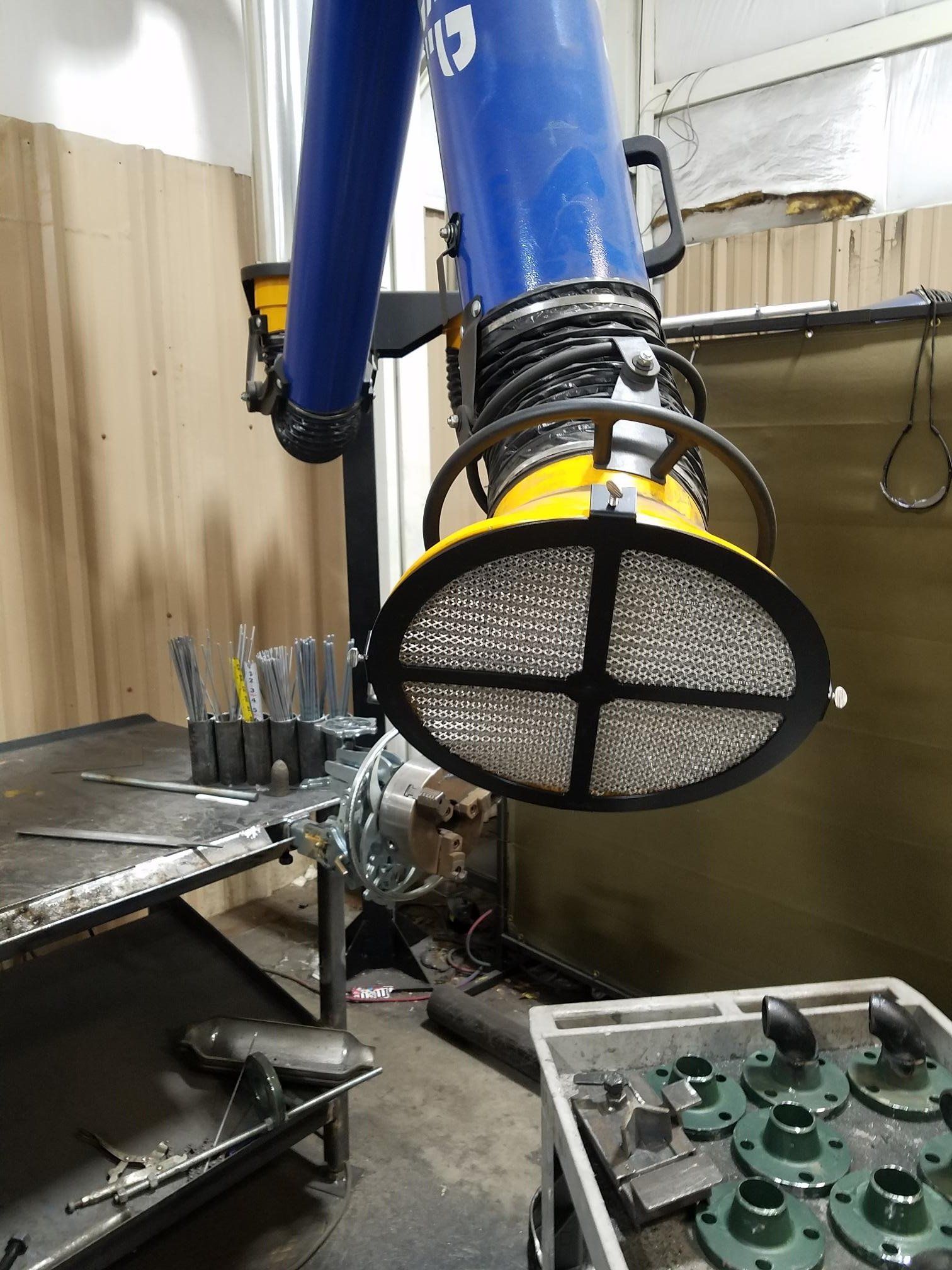 Welding fume extraction arm with spark protection