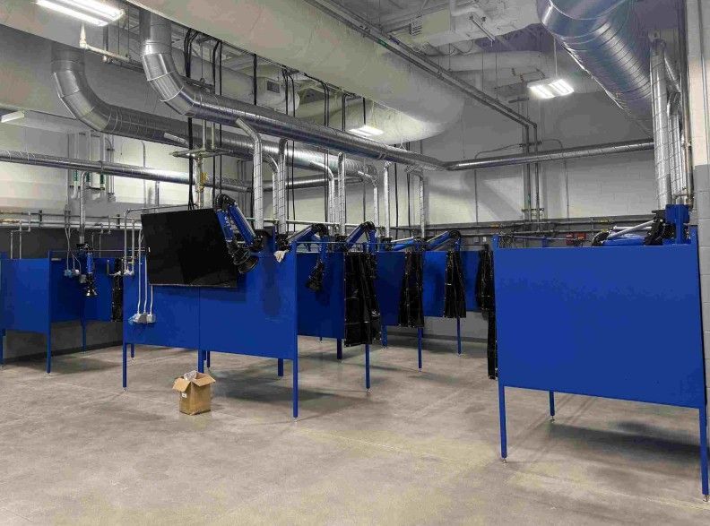 IAP-Weldshell-multiple-rows-of-weld-booths-in-a-trade-school
