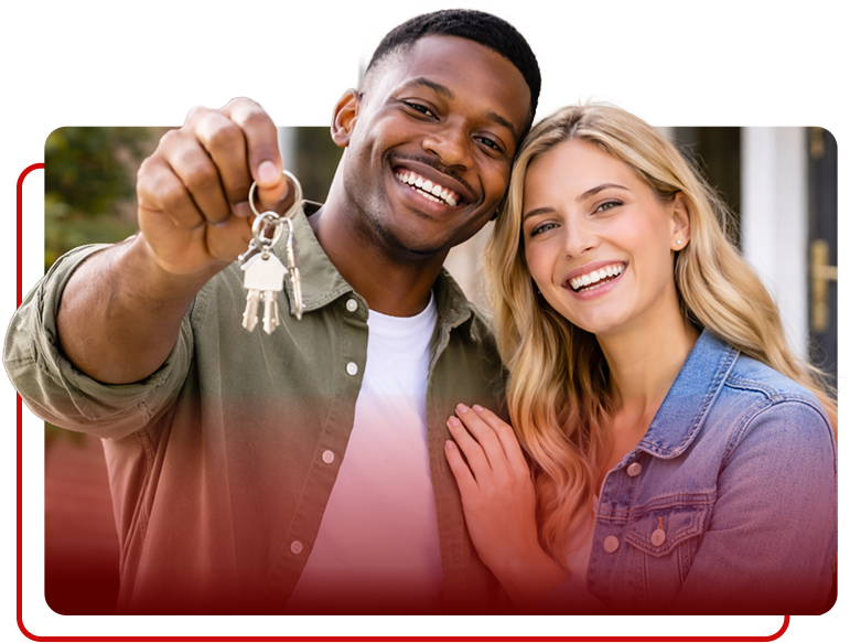 A smiling couple holds up a set of keys, celebrating the purchase of a new home.