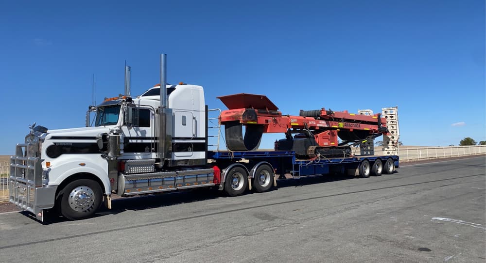 Drop Deck Truck Carrying a Machine — Freight Transport in Wagga Wagga, NSW