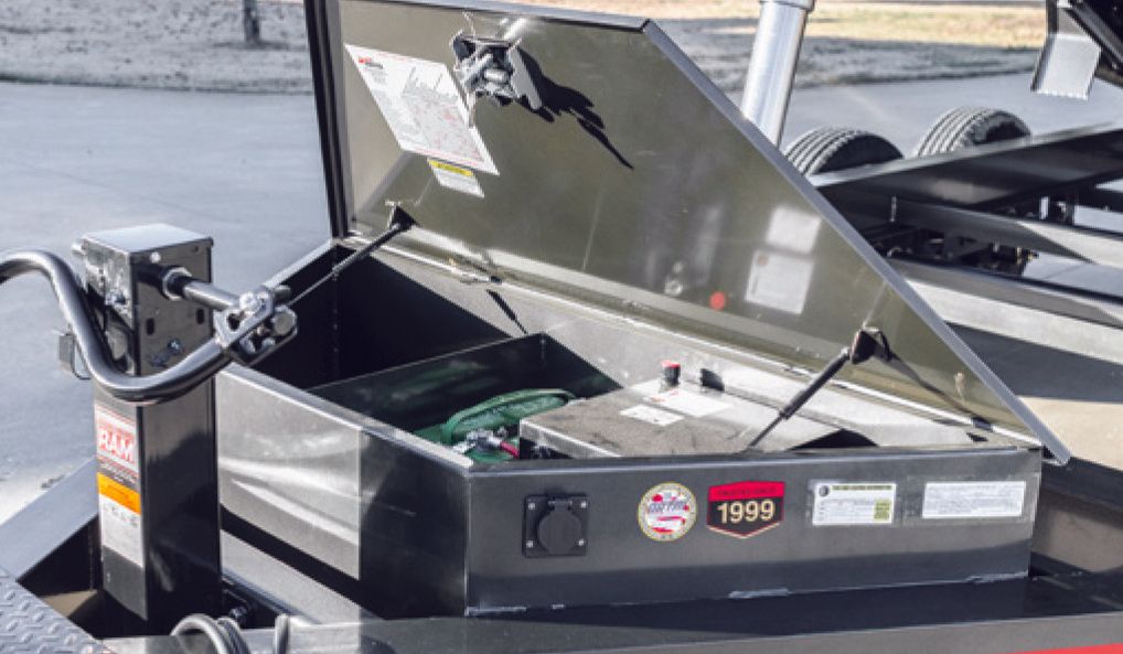 Front of a rental dumpster with a toolbox built into it.