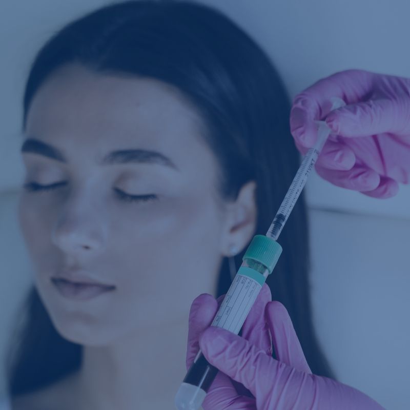 Blue-tinted close-up of a woman with closed eyes and a gloved hand holding a syringe.
