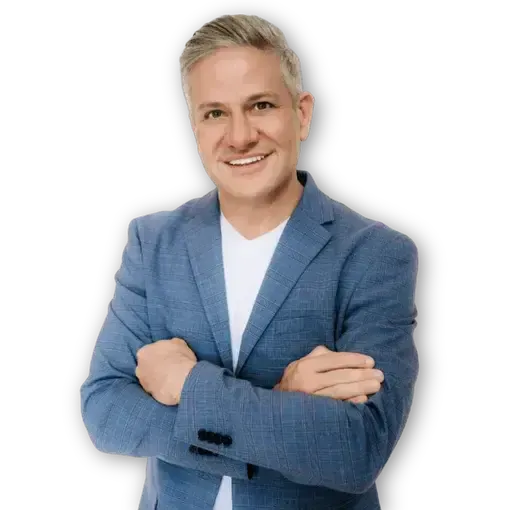 Professional headshot of Dr. Croley smiling in a blue blazer, medical director at Skin & Tonic in Pace, Florida.