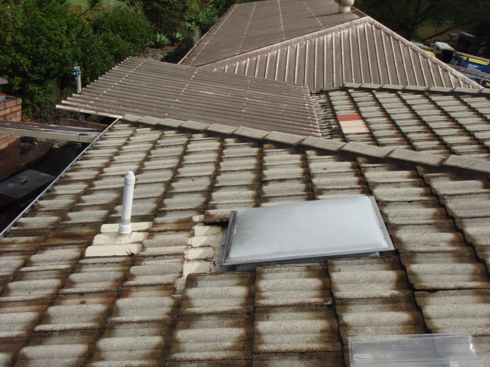 The Roof Of A House With A Skylight On It — Gold Coast Roof Repairs in Mudgeeraba, QLD