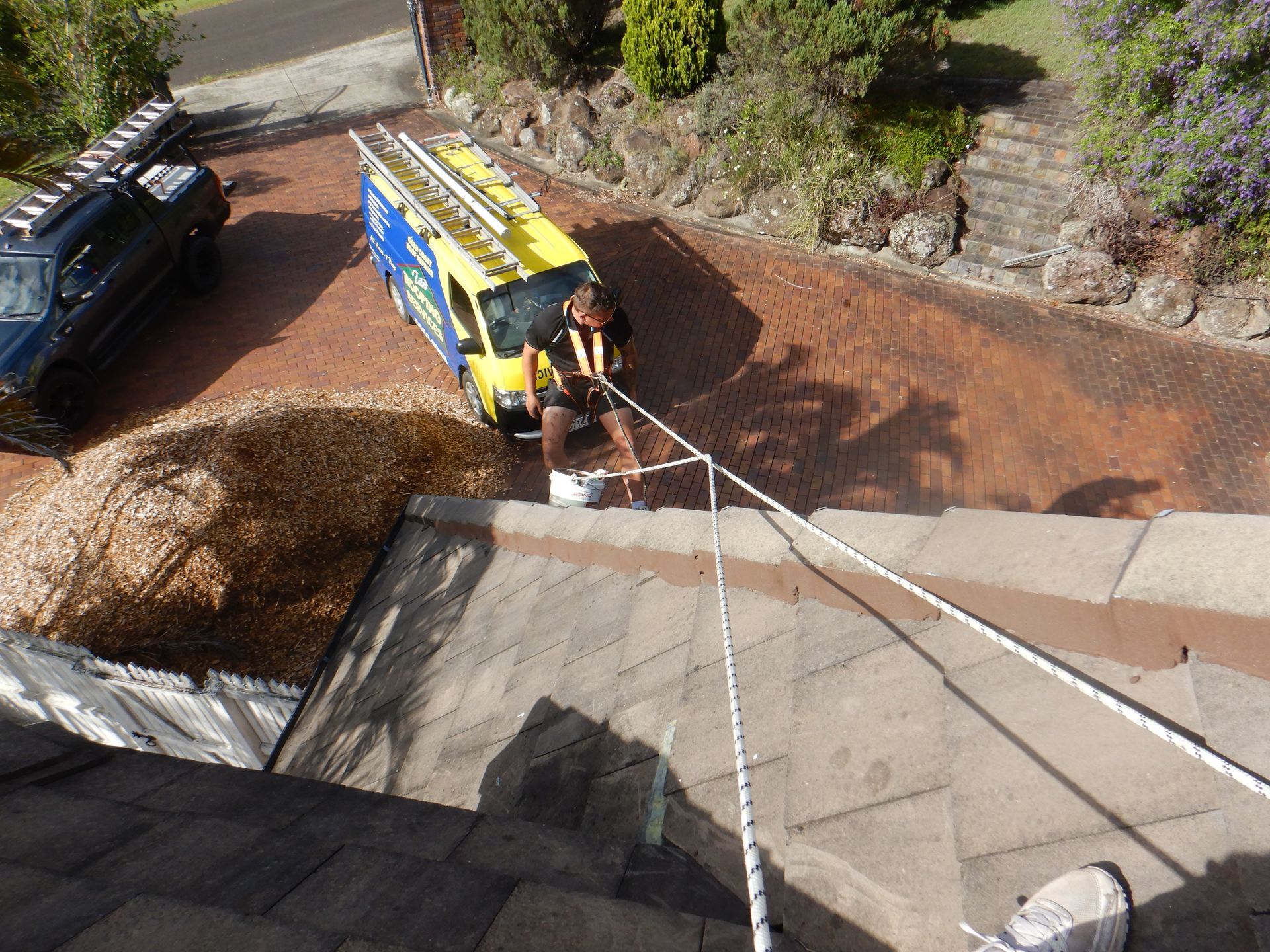 A Roof With Two Windows And A Solar Panel On It — Gold Coast Roof Repairs in Mudgeeraba, QLD
