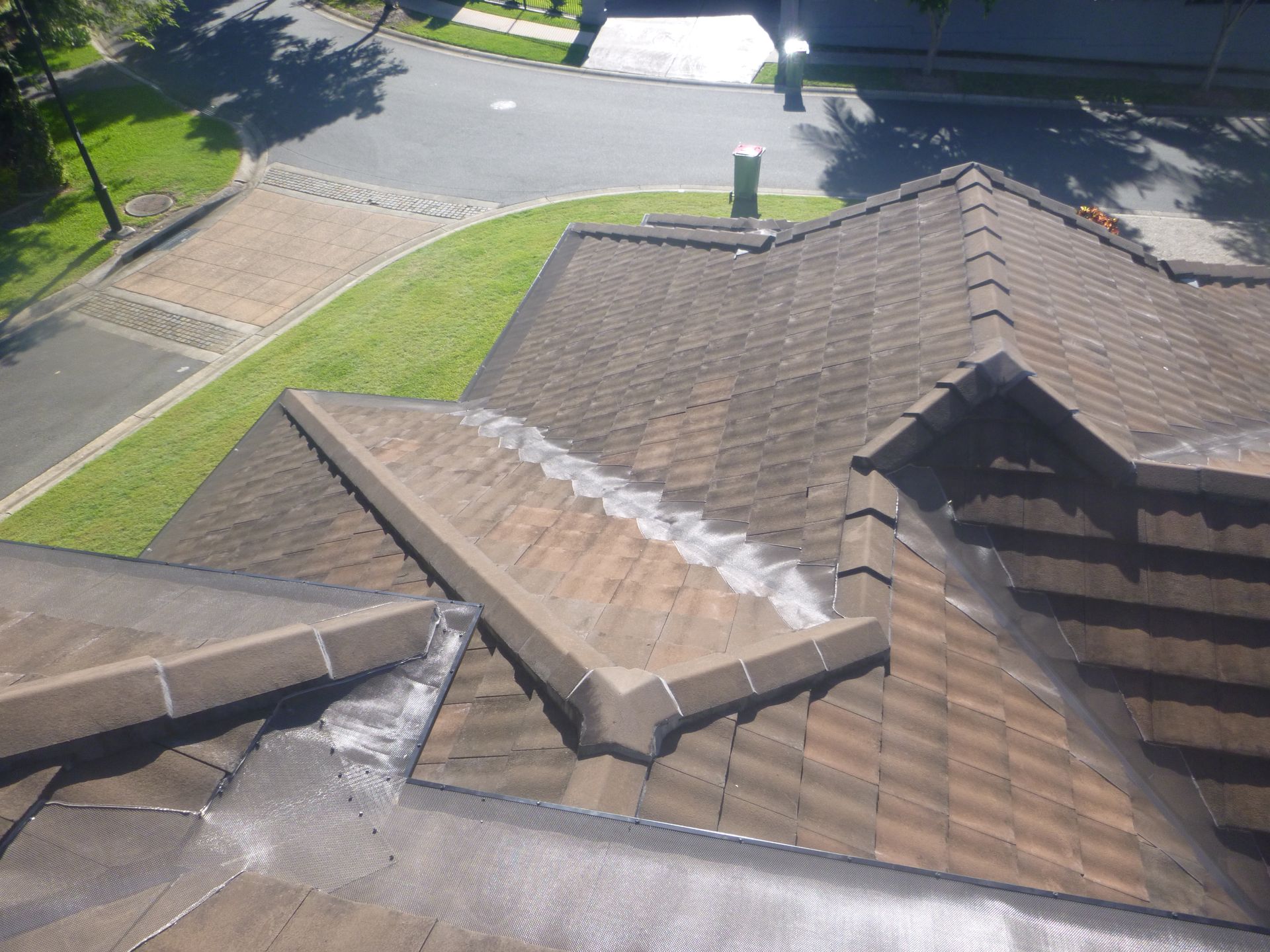 A Gutter With Leaves On It — Gold Coast Roof Repairs in Mudgeeraba, QLD