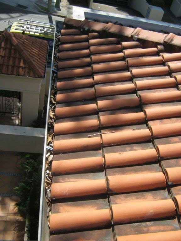 A Roof With A Lot Of Tiles And A Gutter — Gold Coast Roof Repairs in Mudgeeraba, QLD
