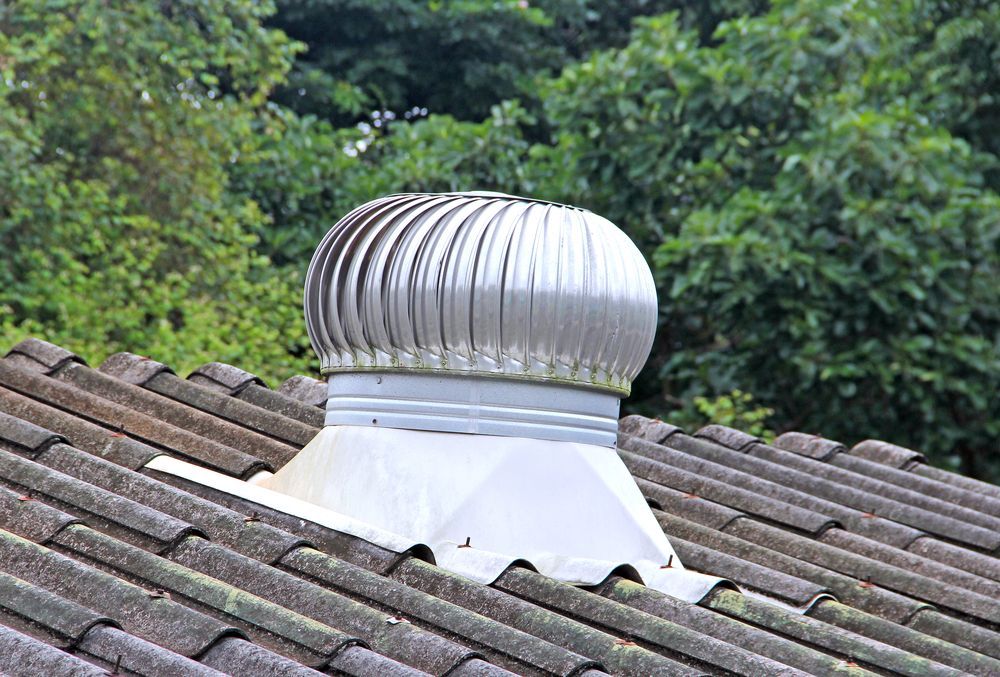 Metal Whirlybird at the Top of Roof