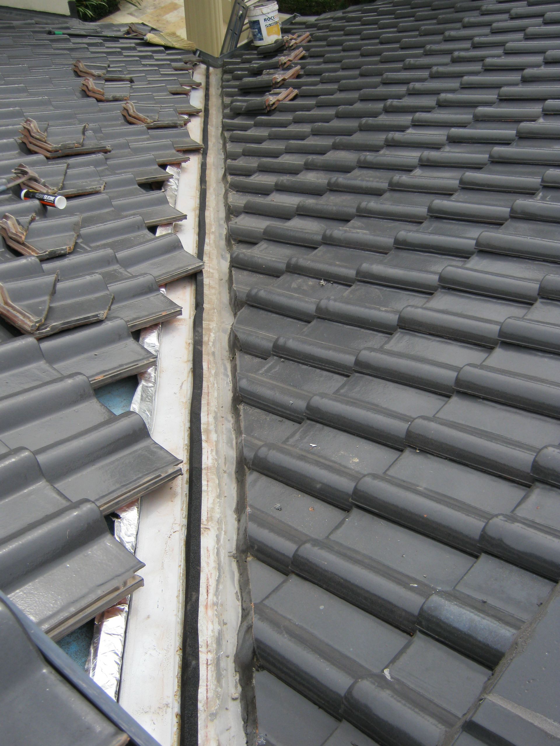 An Aerial View Of A Gray Roof With A Diagonal Pattern — Gold Coast Roof Repairs in Mudgeeraba, QLD