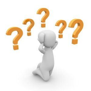 3D figure scratching head with orange question marks floating around it