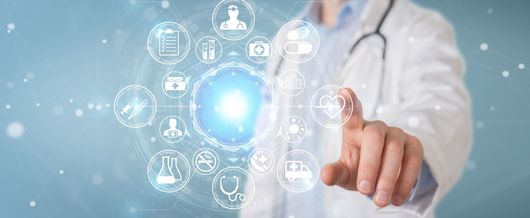 A healthcare professional interacts with a glowing, circular digital interface of medical icons against a blue background.