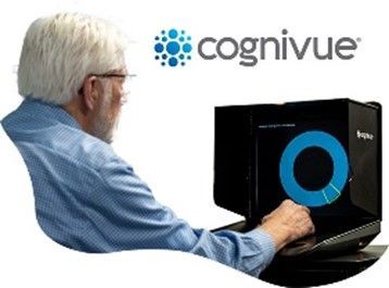 An individual sits at a table using a Cognivue device, interacting with a blue circular graphic on a screen.