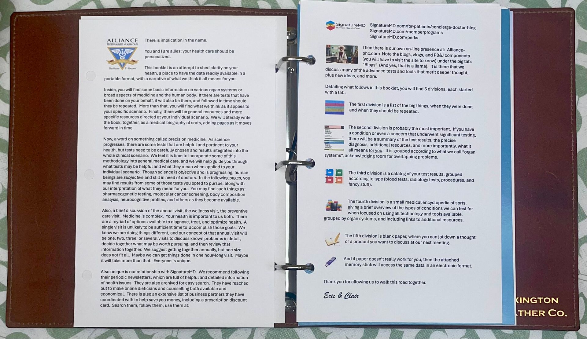 Open binder with typed document pages on a wooden table, one page of text and one page of colored list items.