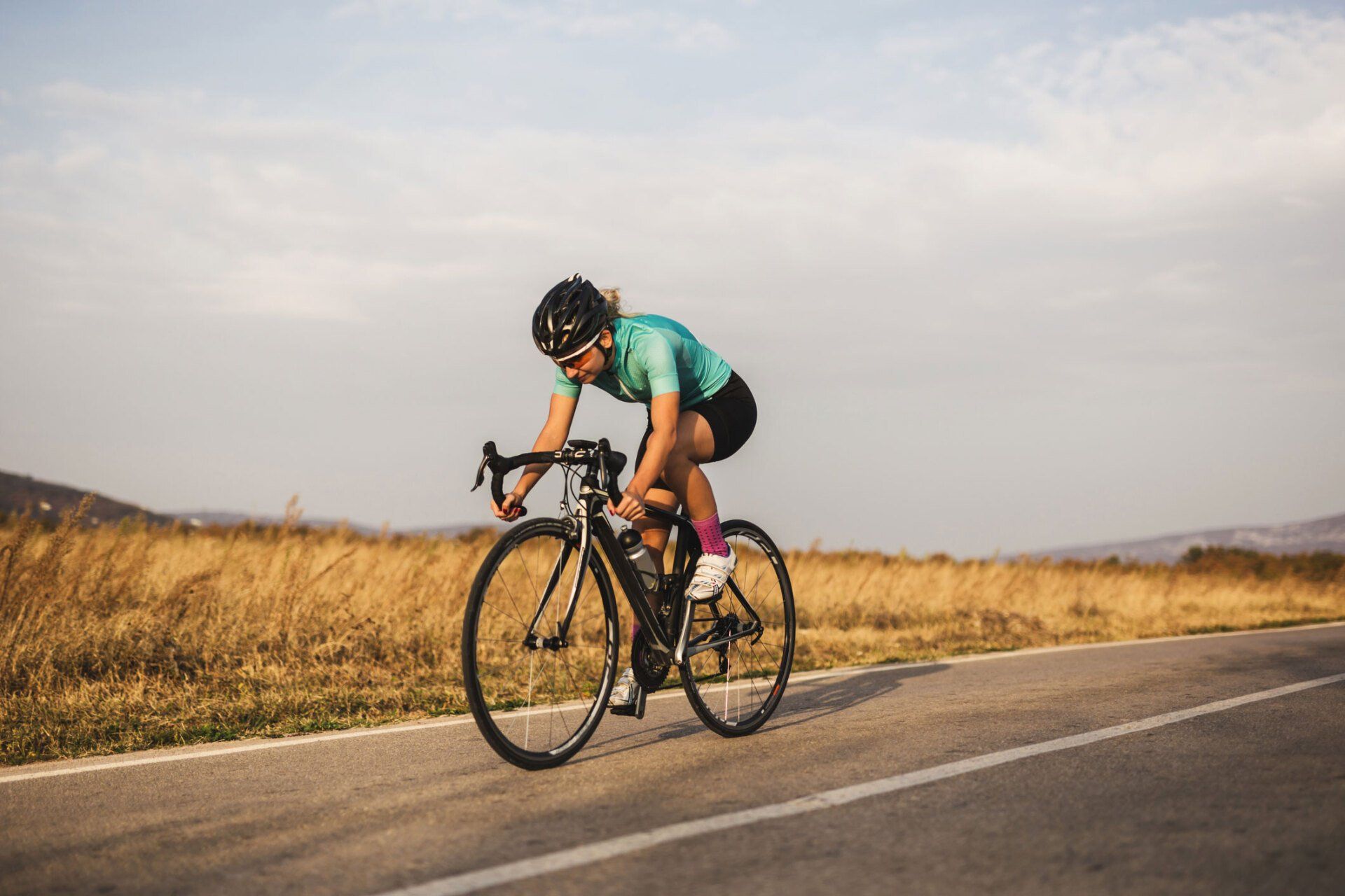 Professional Female Cyclist on The Road — North Geelong, VIC — Marshall’s Cycles