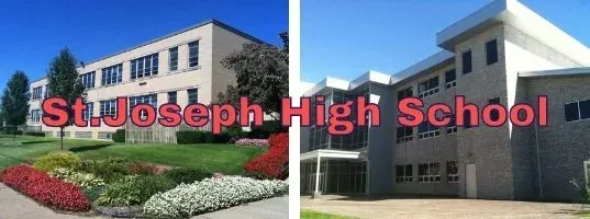 St. Joseph High School campus buildings with red sign in front and blue sky overhead