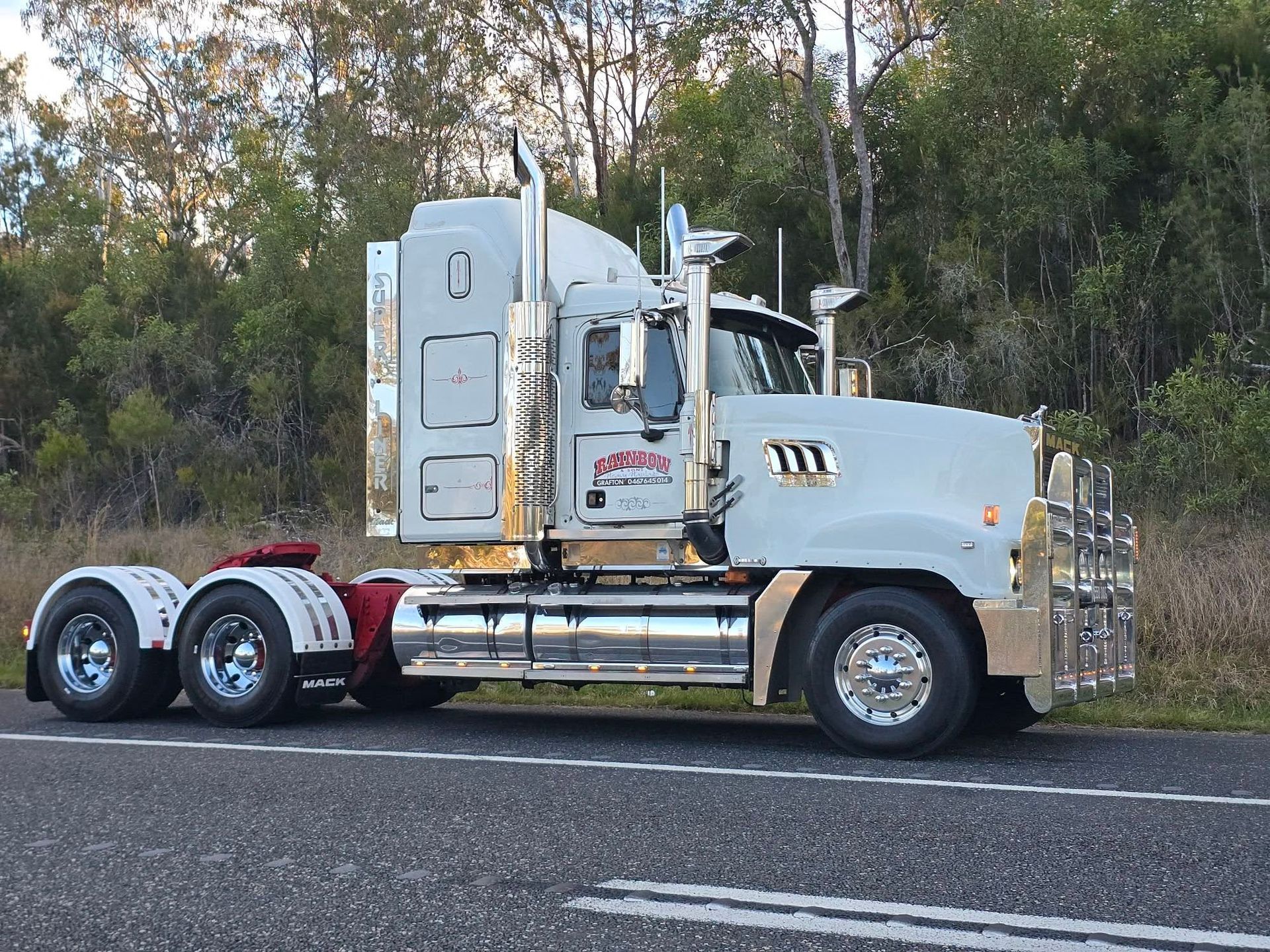 White Semi-Truck Parked on Roadside, Side View — Rainbow and Sons Heavy Haulage in Wells Crossing, NSW