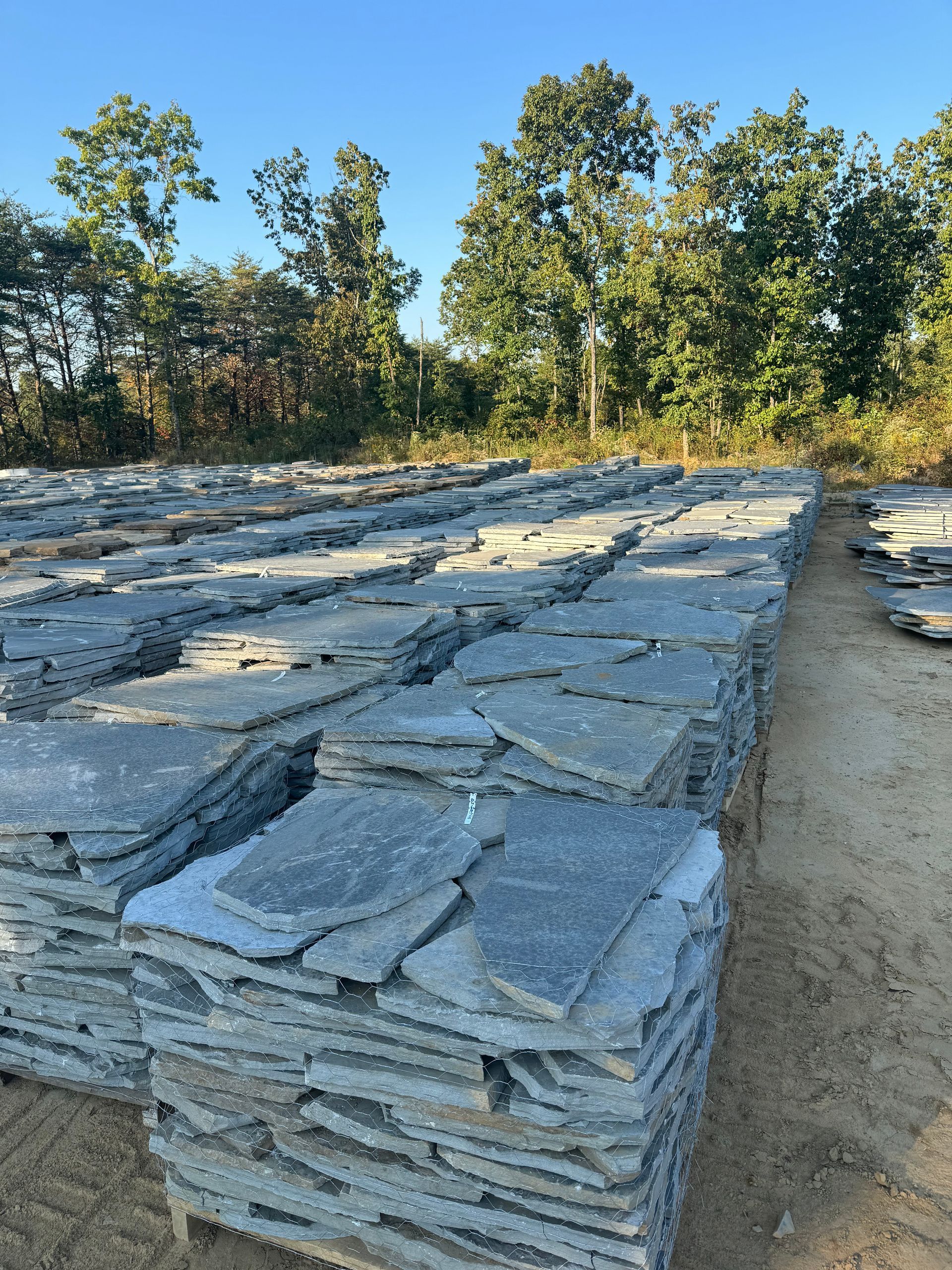 A pile of rocks stacked on top of each other in a field