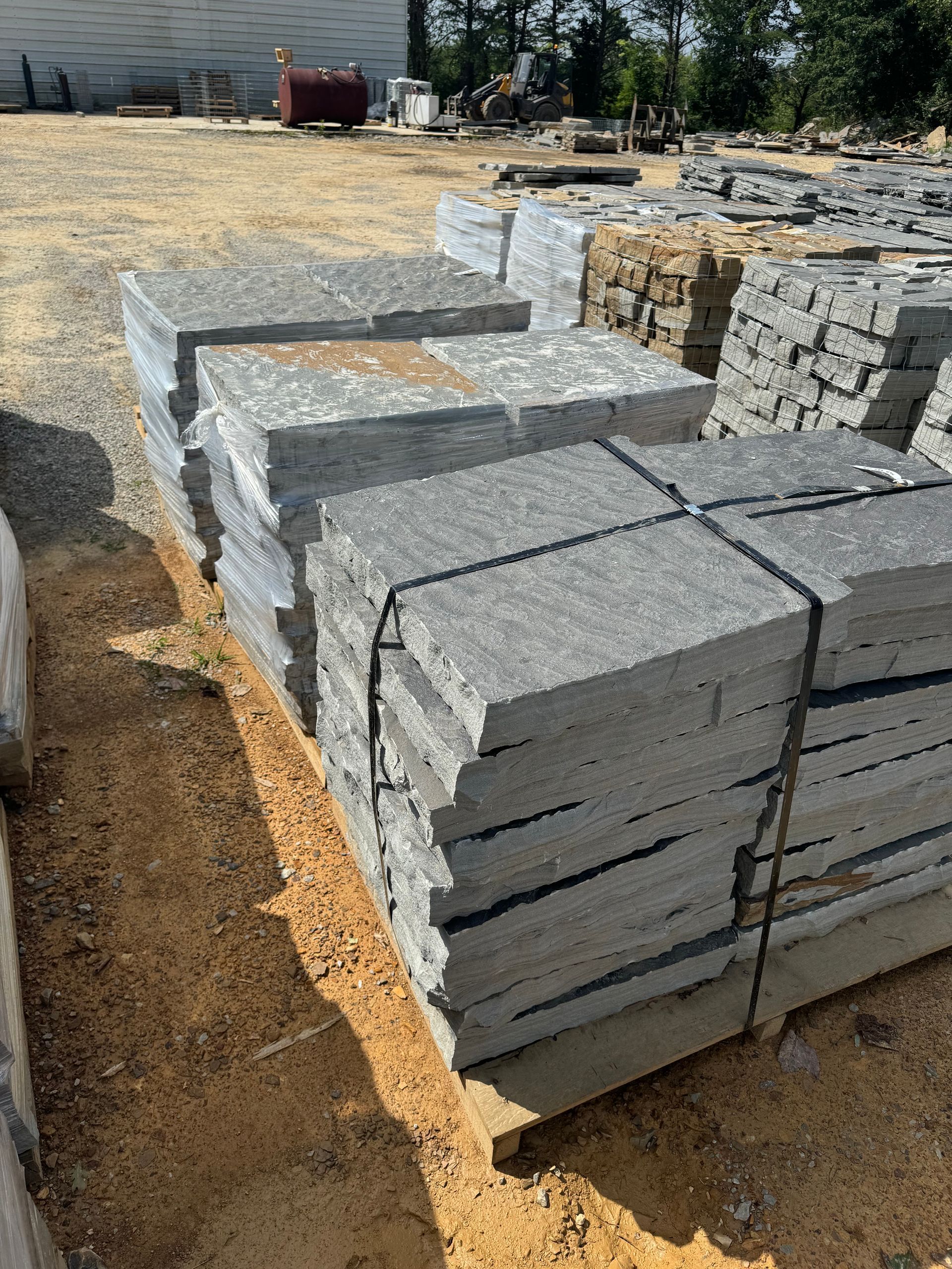 A pile of concrete blocks stacked on top of each other on a pallet.