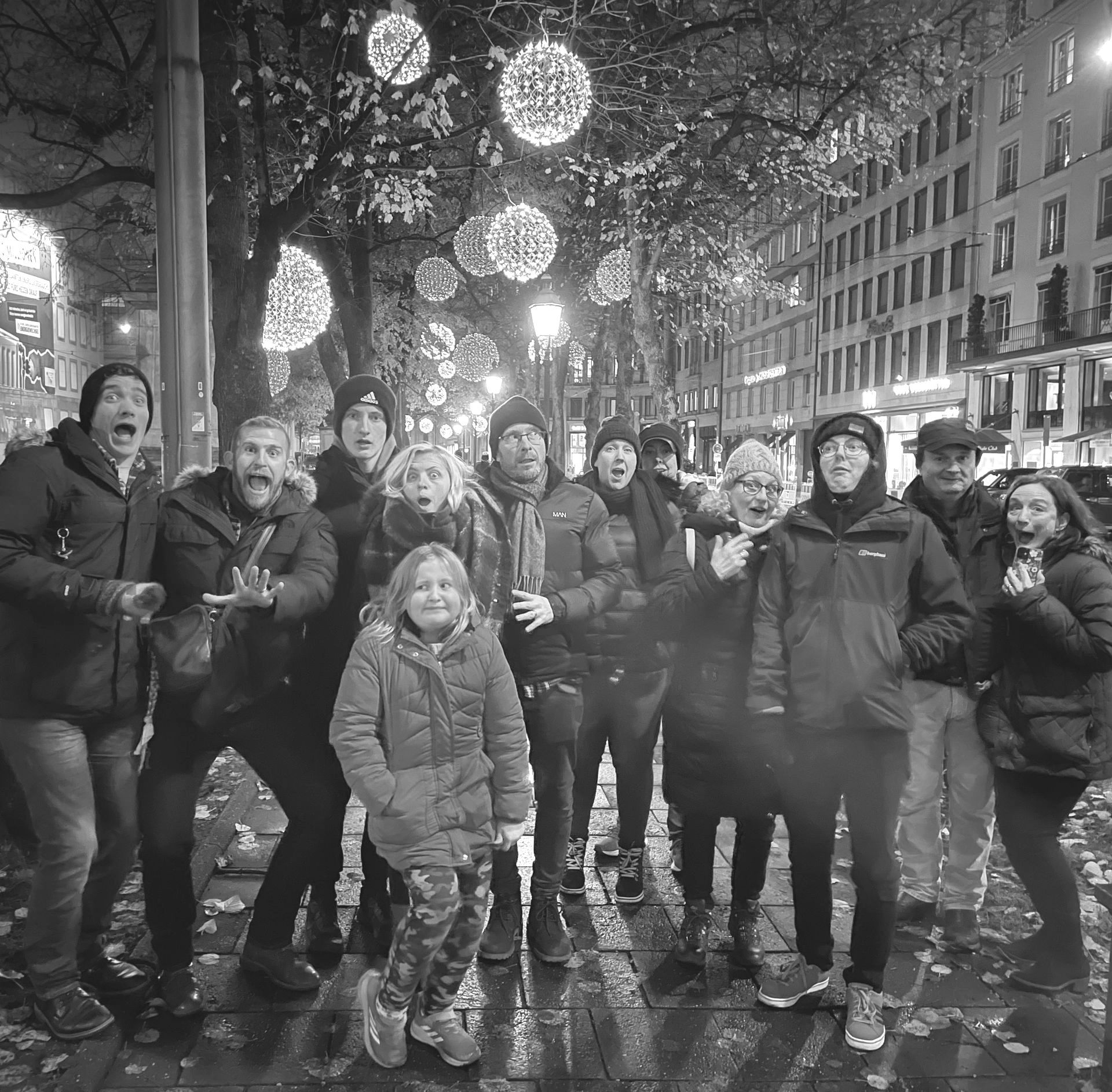 A black and white photo of a group of people posing for a picture