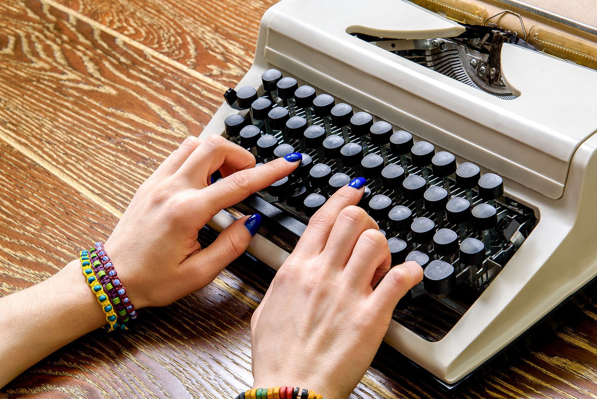 Close up of female arms using typewriter | Reptronics | Clarkstown, NY