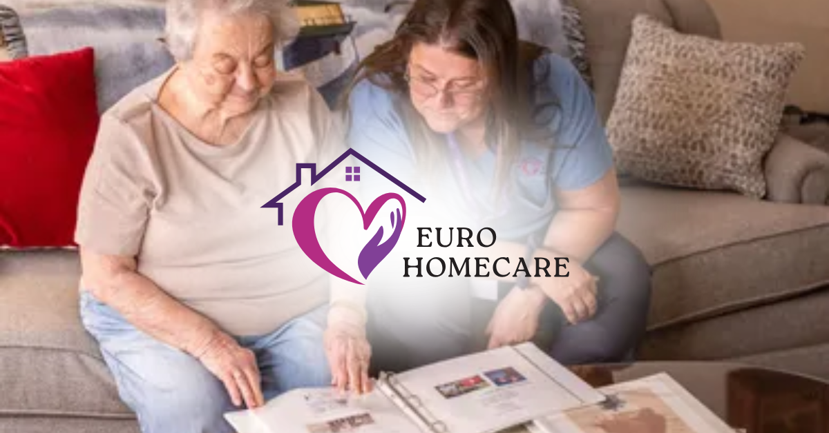 Elderly woman and caregiver reviewing photo album on a sofa, with Euro Homecare logo overlay.