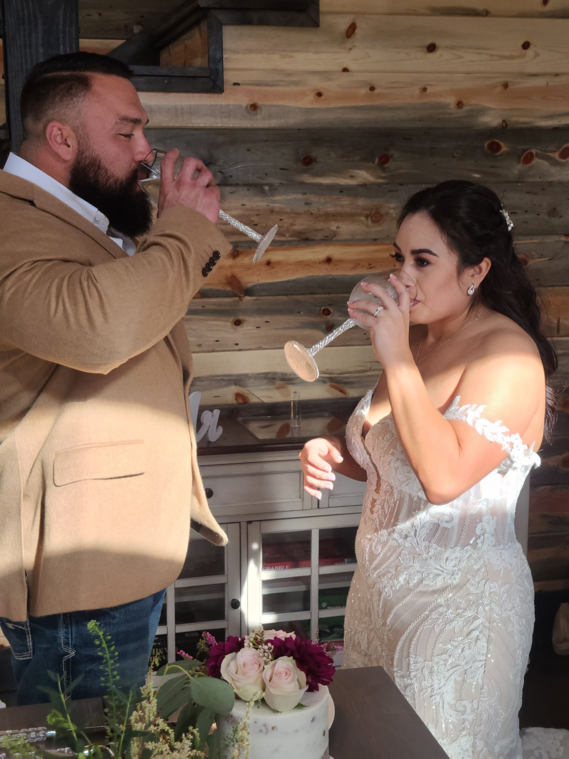 bride and groom making toast