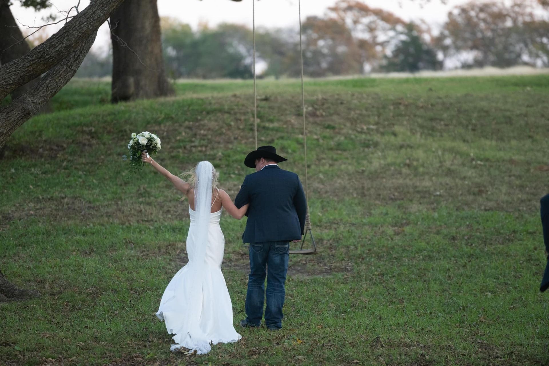bride and groom walking arm in arm
