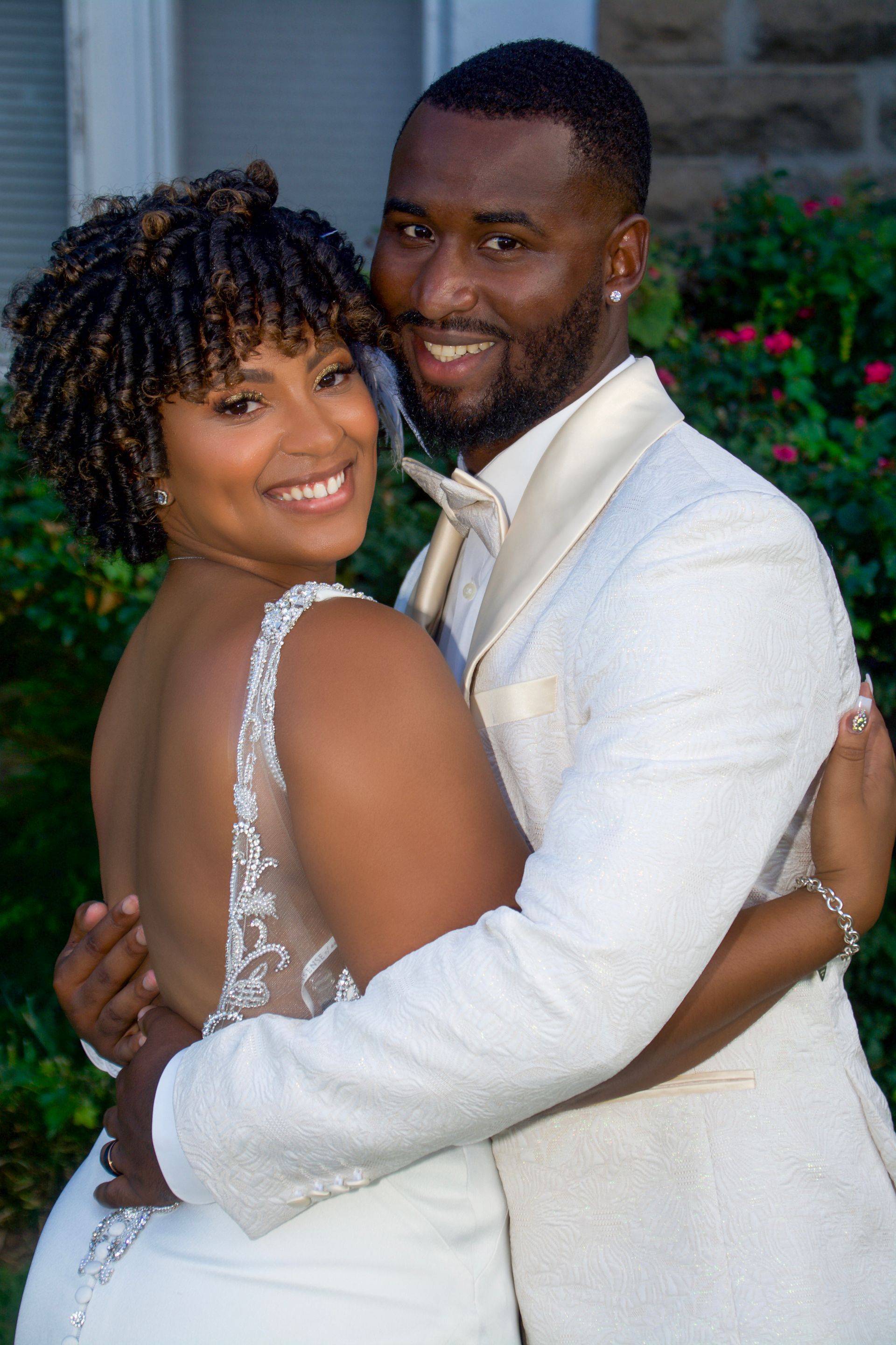 bride and groom embracing and smiling