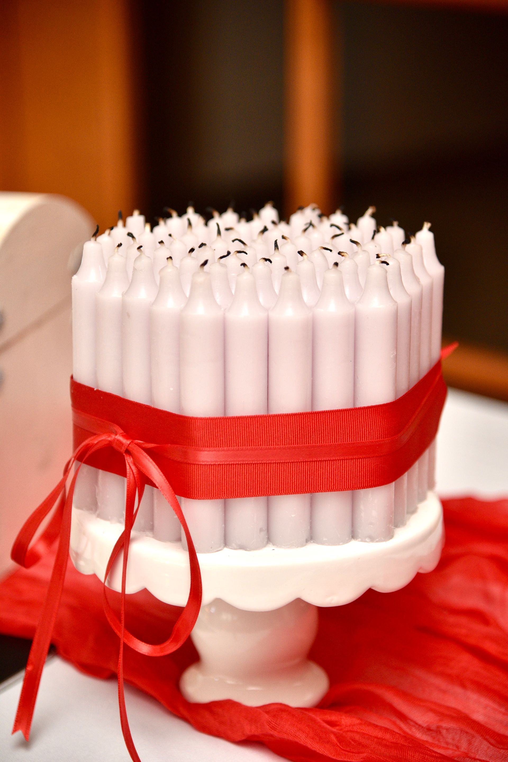 birthday candles tied with red ribbon