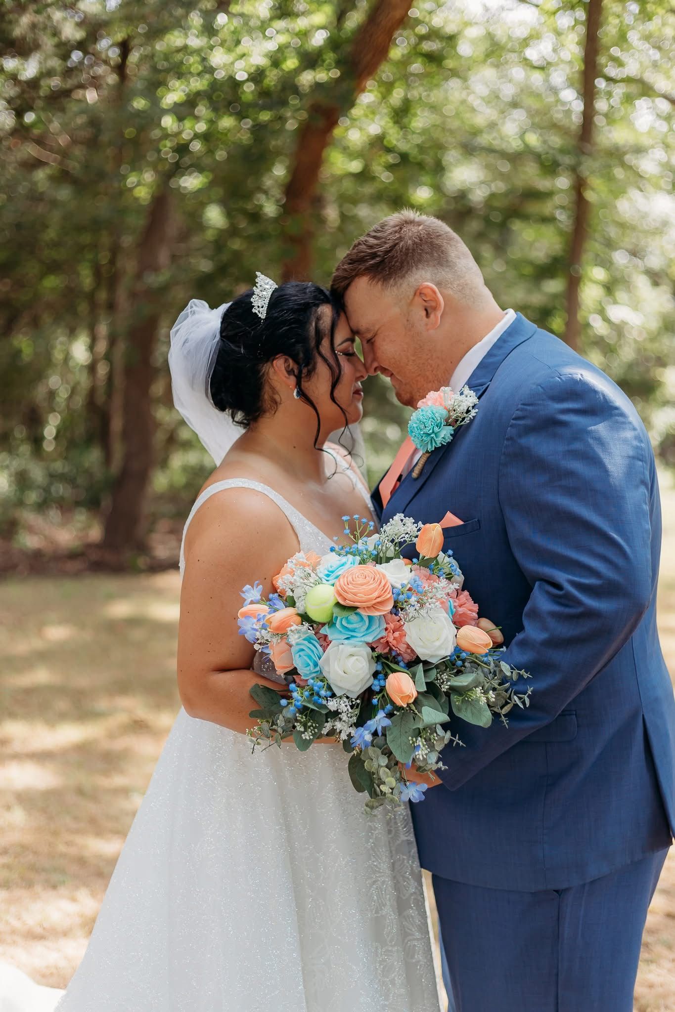 bride and groom touching foreheads