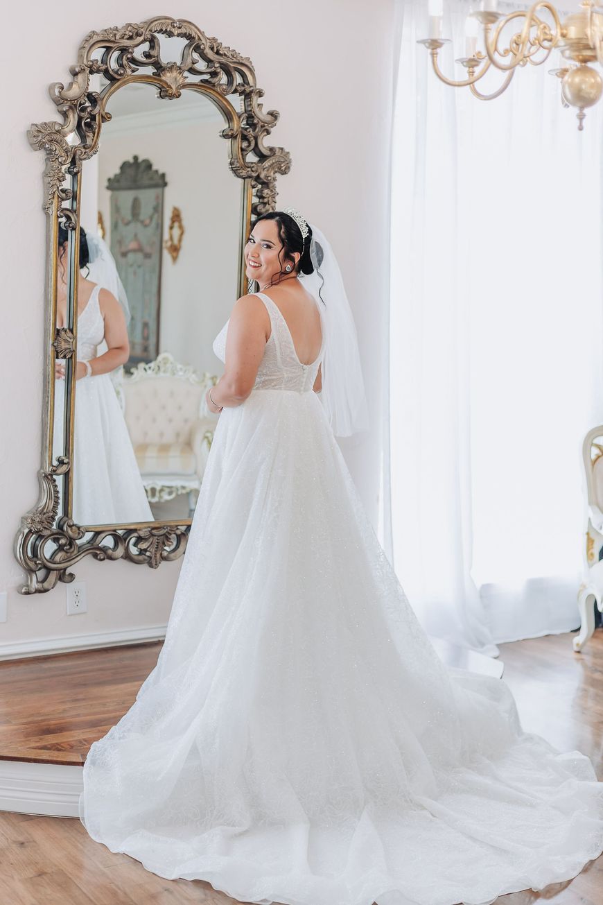 bride smiling in mirror