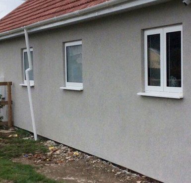 before and after rendered cladding house Quality Render Specialists Basildon