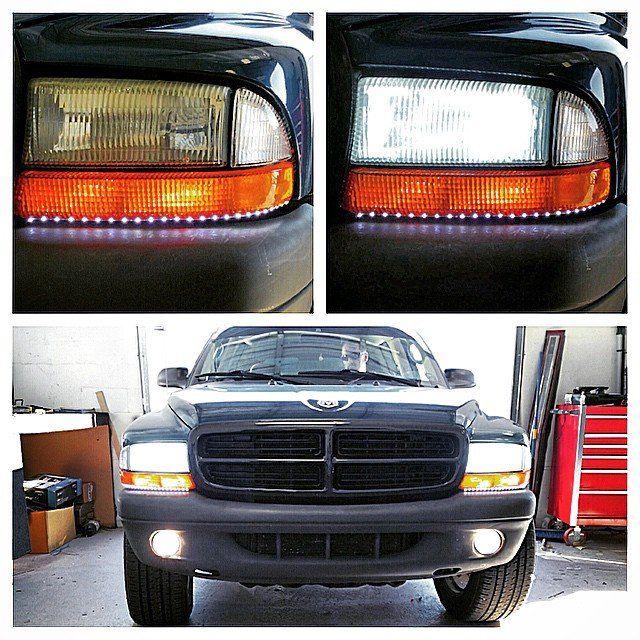 Black Dodge Durango with custom LED headlights, turned on and off.