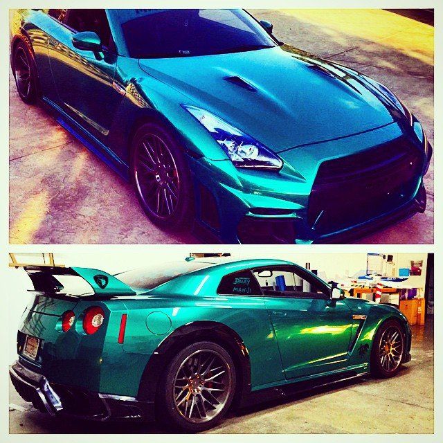 Teal Nissan GT-R sports car, front and rear views. It has a large spoiler, dark wheels, and is parked outdoors.