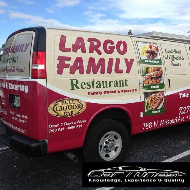 A red and beige van advertising 