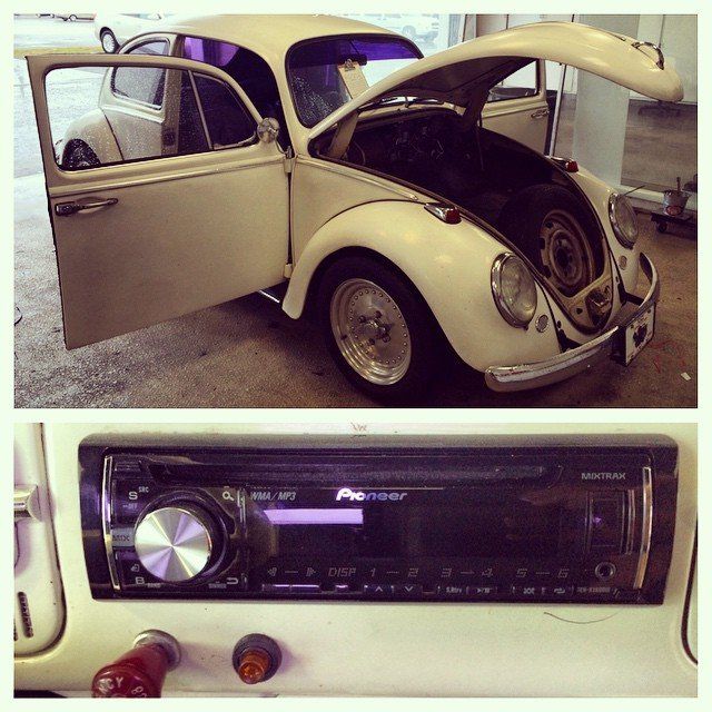 White VW Beetle with open hood and door, Pioneer radio installed.