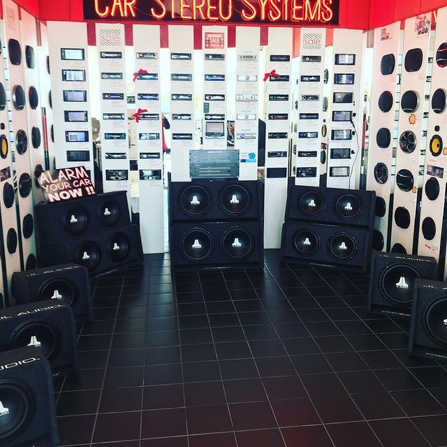 Car stereo shop with speaker displays.