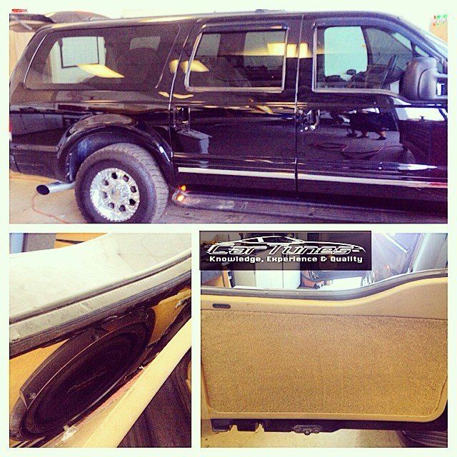 Black SUV with tinted windows; car audio installation with speakers and interior door panel.
