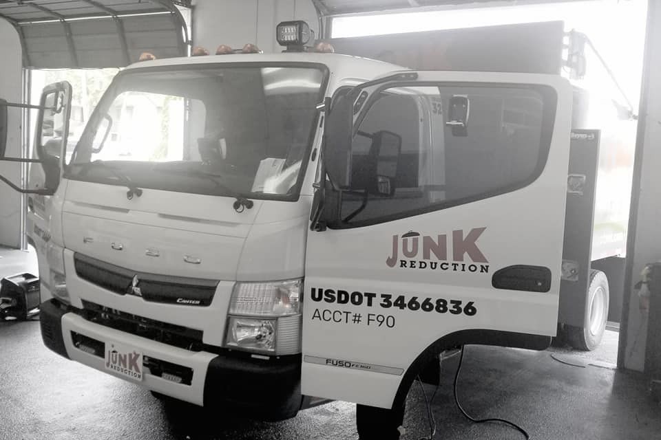 White truck with open door; 