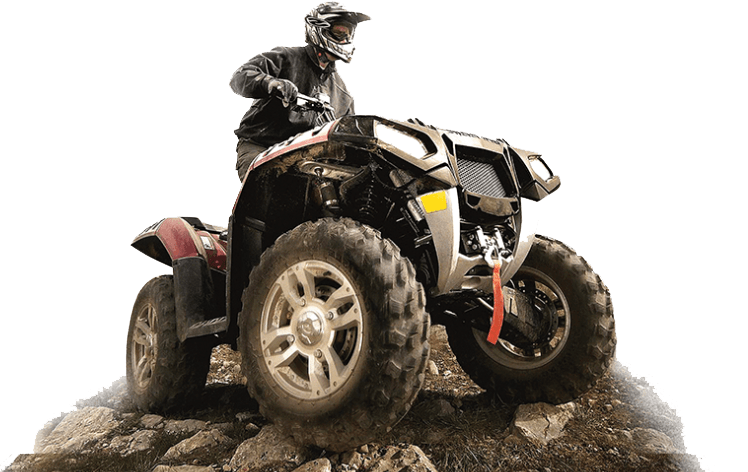 Person on ATV, climbing over rocks.