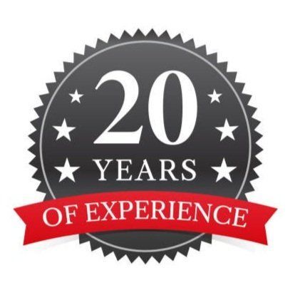 A 20 years of experience badge with a red ribbon