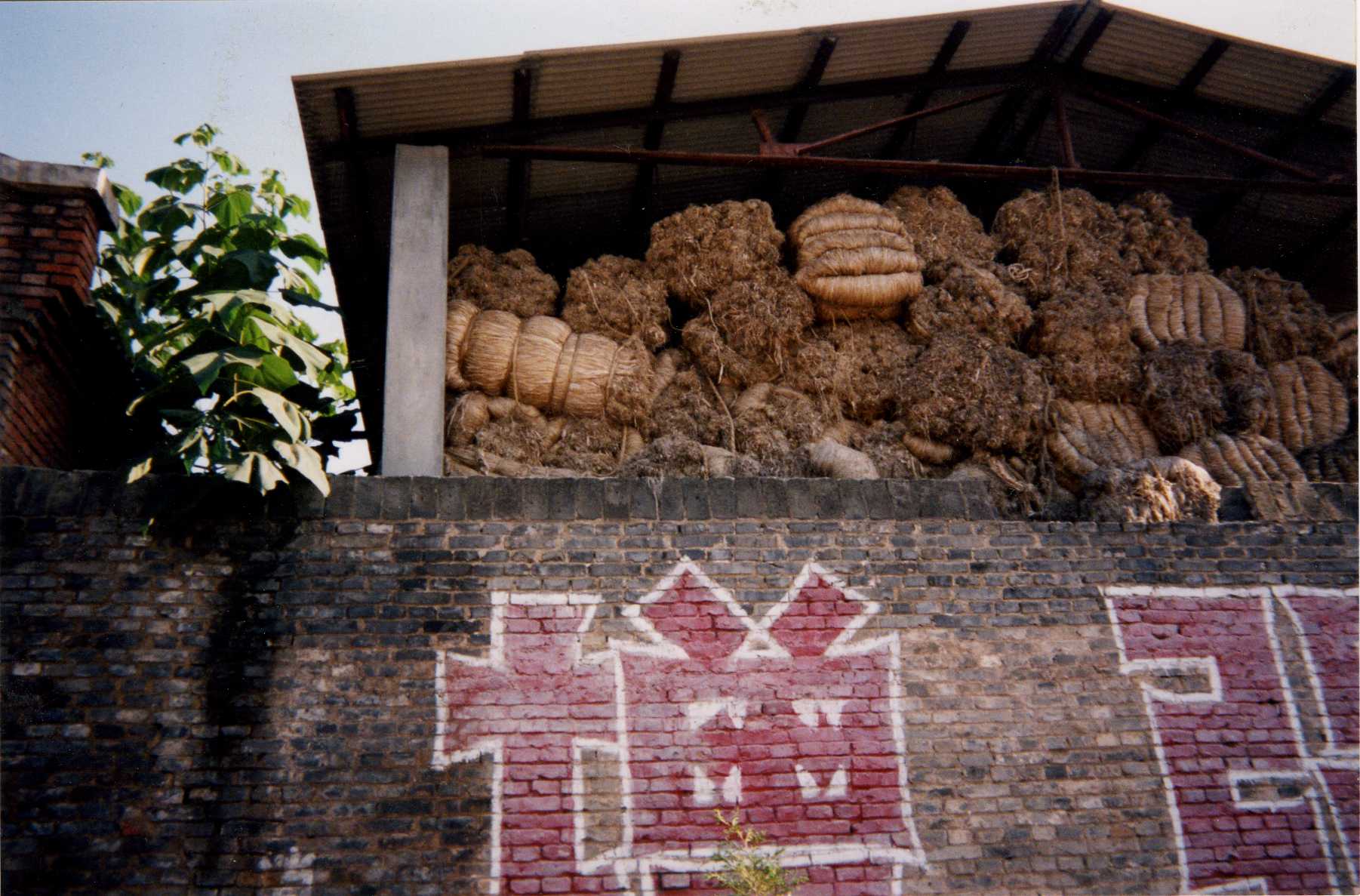 A brick wall with graffiti on it that says tp on it